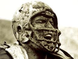 Muddy-face-football-player